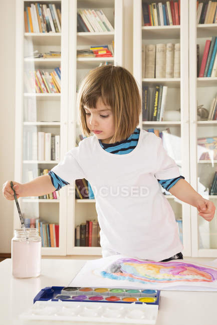 Portrait of little girl painting with watercolours — Stock Photo