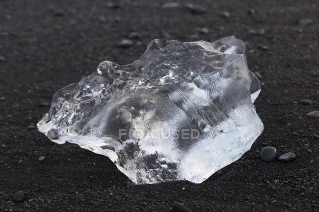 Close up of ice on black sand, Iceland — Stock Photo