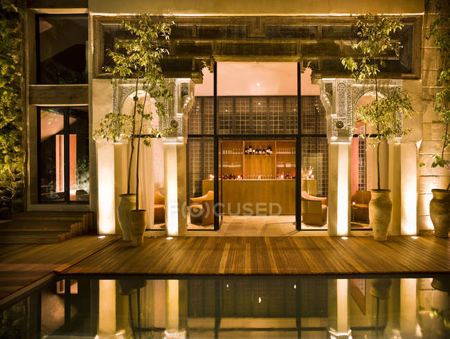 Morocco, Fes, Hotel Riad Fes, courtyard with swimming pool by night ...