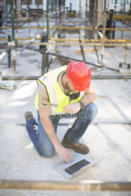 Construction Worker Using Tablet On Construction Site — Modern