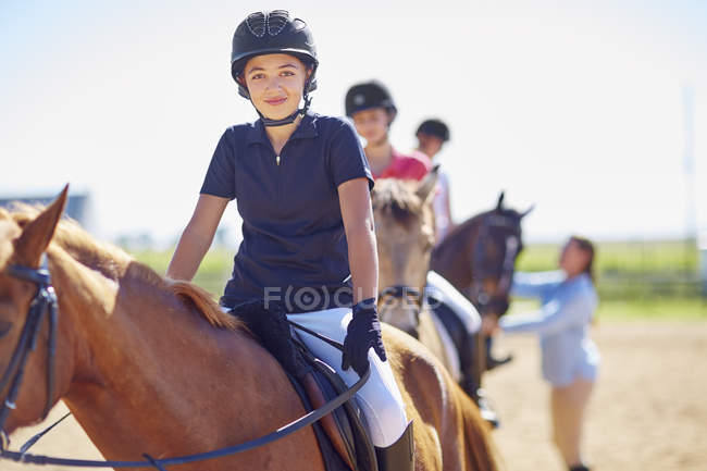 Portrait of confident girl on horse — Stock Photo