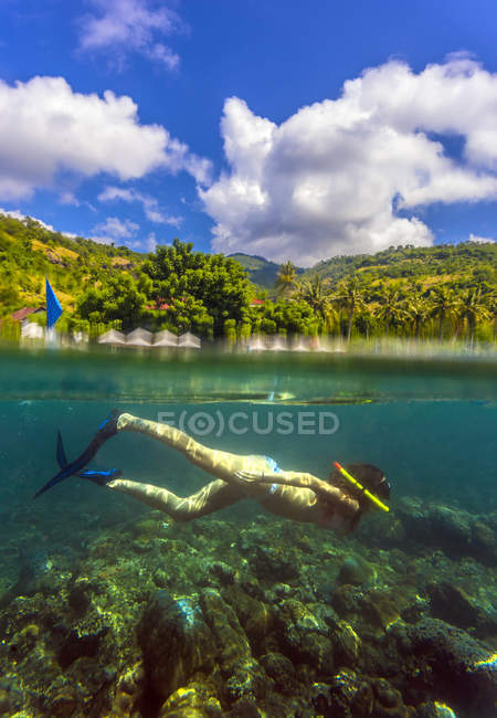 Indonesia, Bali, Amed, young woman snorkeling — Stock Photo