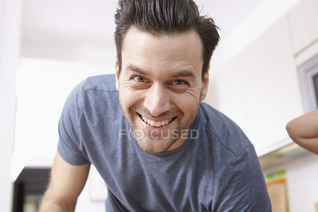 Portrait of mid adult man at home looking at the camera — Stock Photo