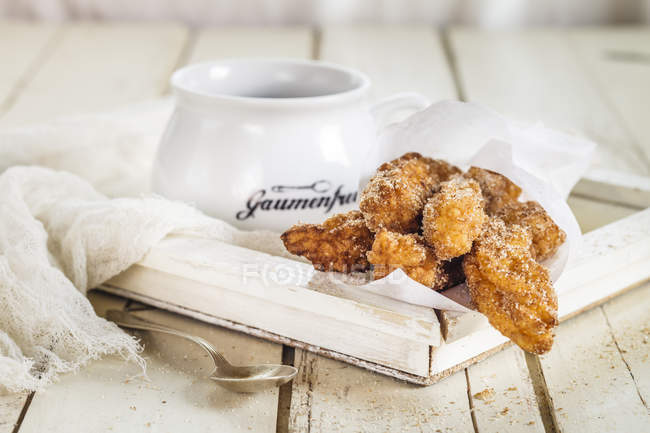 Churros with hot chocolate — Stock Photo