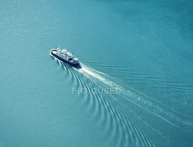 ferry-boat-cruising-the-sea-aerial-view-shipping-ocean-stock-photo-180804710