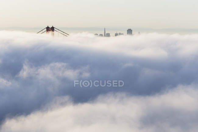 USA, California, San Francisco, skyline and Golden Gate Bridge in fog — Stock Photo