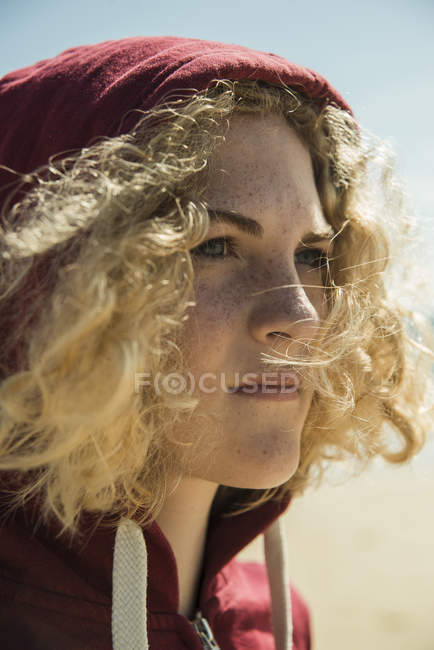 Portrait of teenage girl wearing hooded jacket — Stock Photo