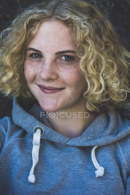 Portrait of smiling teenage girl with freckles — Stock Photo