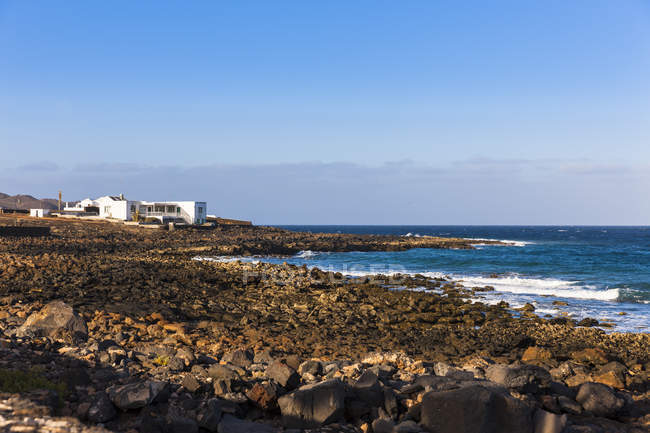 Spain, Canary Islands, Lanzarote, Costa Teguise, El Orinete, House at the coast  during daytime — Stock Photo