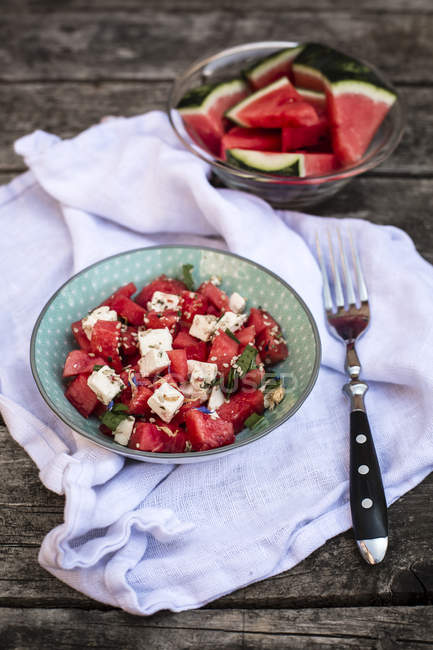 Closeup of fresh watermelon salad with feta cheese, mint and sesame — Stock Photo