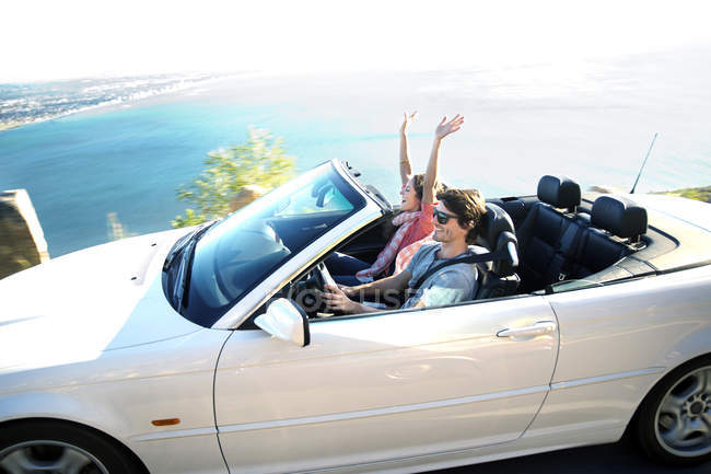 South Africa, happy couple in convertible on coastal road — Stock Photo