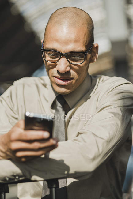 Businessman looking on smartphone — Stock Photo