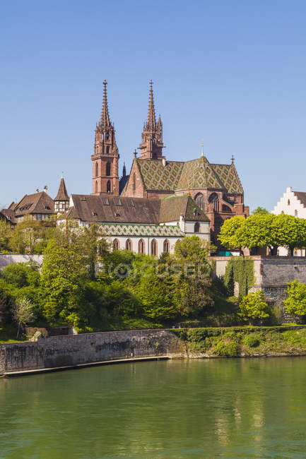Switzerland, Basel, Rhine and Minster view on riverbank in bright sunny day — Stock Photo