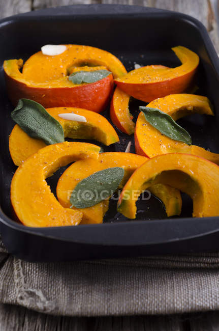 Baked pumpkin in tray, studio shot — Stock Photo