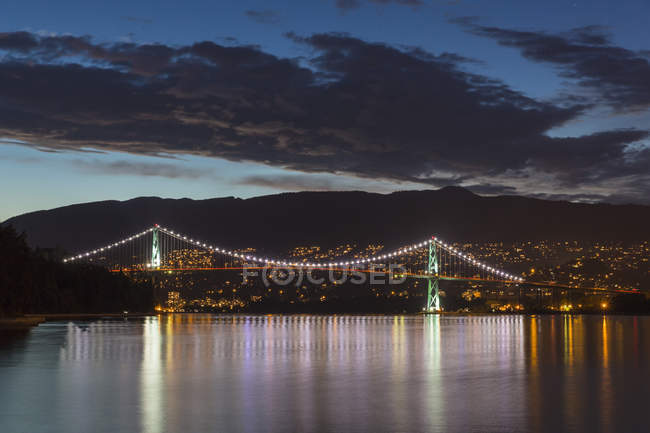 Canada, Vancouver, Lions Gate Bridge illuminated at night — Stock Photo