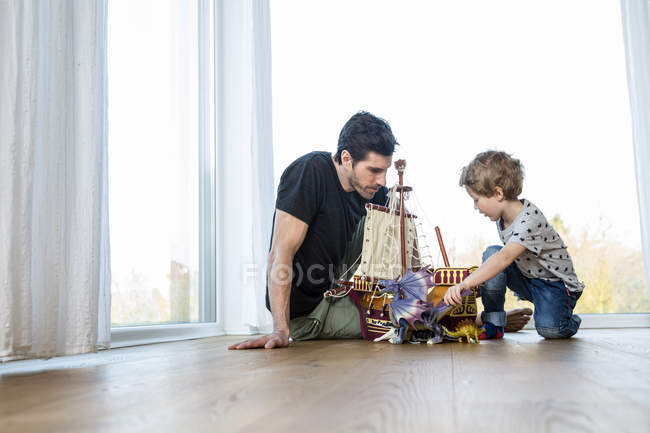 Father And Son Playing With Toys Two People Copy Space Stock