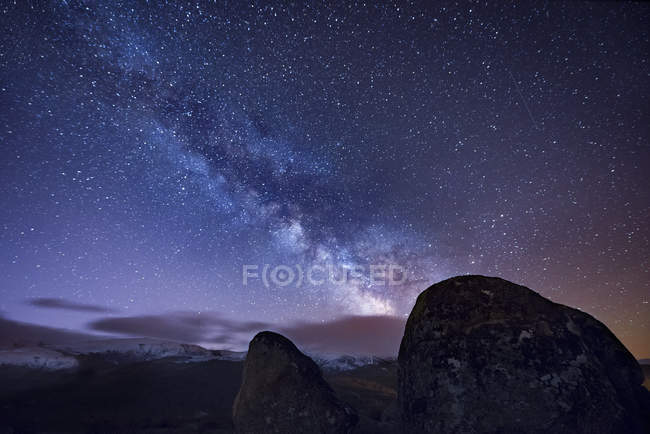 Milky way over ancient granite rocks — Stock Photo