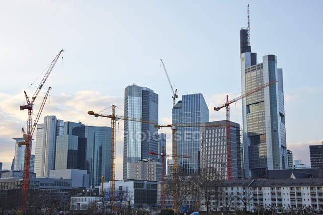 Germany, Hesse, Frankfurt, view to skyscrapers and construction cranes — Stock Photo