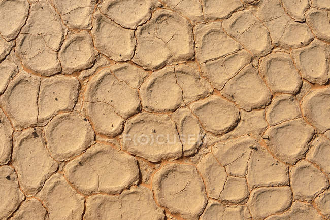 Algeria, Tassili n' Ajjer, Sahara, broken surface of a salt and clay pan — Stock Photo