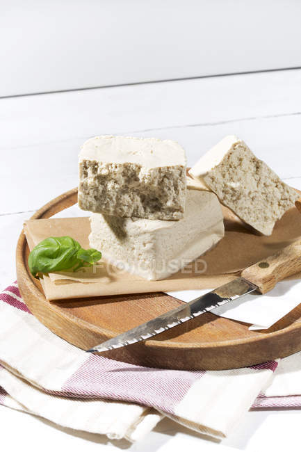 Organic tofu on chopping board — Stock Photo