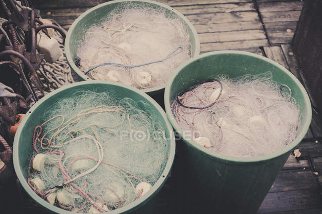 Germany, Mecklenburg-Western Pomerania, Ruegen, Fishing nets in buckets in winter — Stock Photo