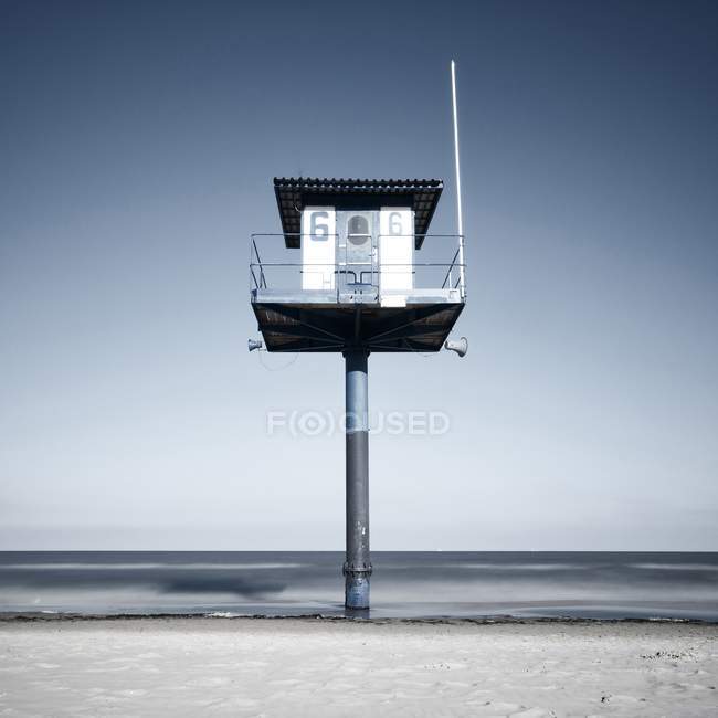 Lifeguard station at the beach over water — Stock Photo