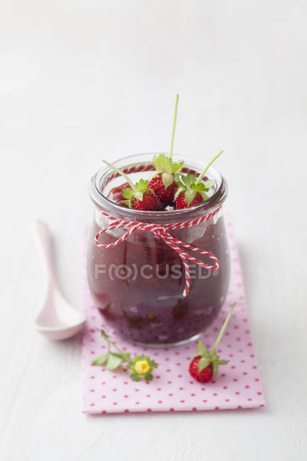 Jar of wild strawberry jam — Stock Photo
