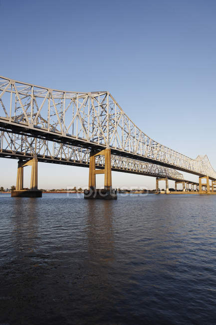 USA, New Orleans, Bridge over Mississippi river and blue sky on background — Stock Photo
