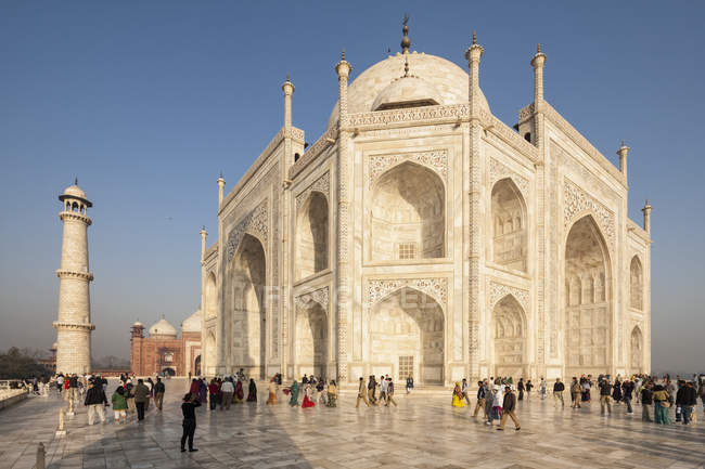 Tourist visiting Taj Mahal — background, minaret - Stock Photo | #182493054