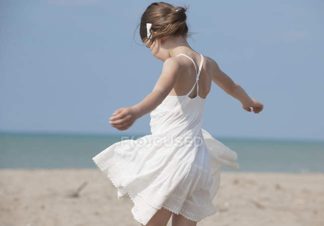 Small Girl playing on beach — Stock Photo