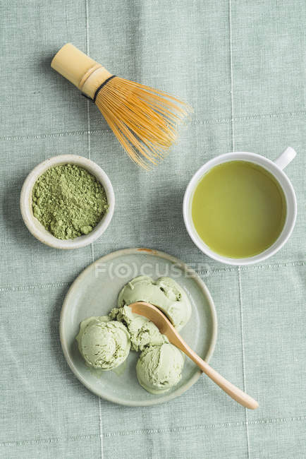 Green tea icecream, matcha tea and Chasen tea whisk — Stock Photo