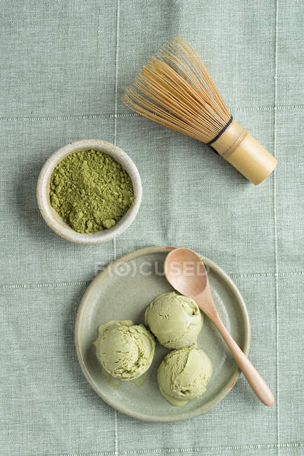 Green tea icecream and Chasen tea whisk — Stock Photo