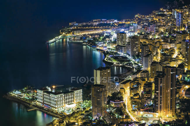 Monaco, Monte Carlo at night against water — Stock Photo