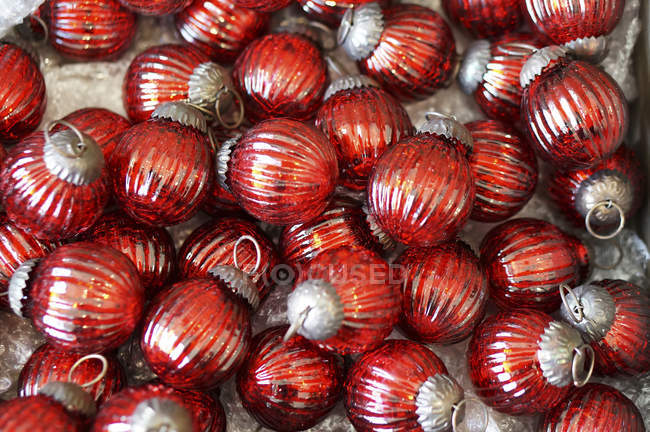 Pile of red christmas tree balls, close up — Stock Photo