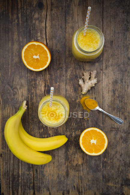 Orange banana smoothie with ginger and curcuma — Stock Photo