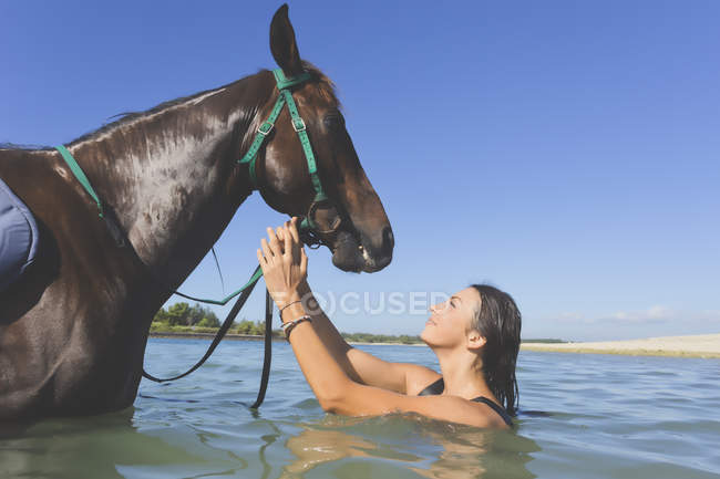 Indonesia, Bali, Woman with horse — Stock Photo