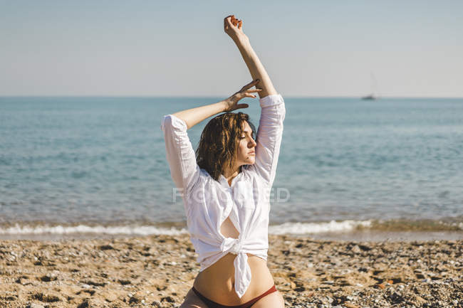 Portrait of attractive young woman on the beach — Stock Photo