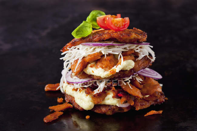 Veggie Burger made of potato fritters,  sweet potatoes, soy meat, remoulade and Barbecue sauce — Stock Photo
