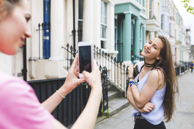 focused_258954736-stock-photo-young-woman-taking-cell-phone.jpg