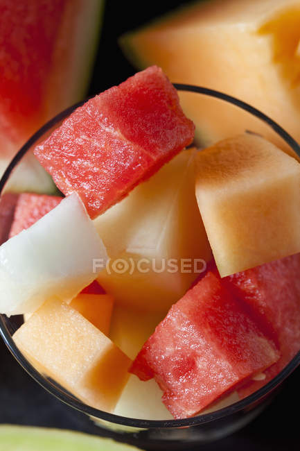 Cubes of fresh melon and watermelon in glass — Stock Photo