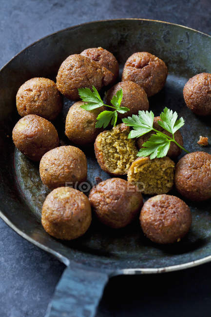 Vegan vegetable balls and parsley leaf in pan — Stock Photo