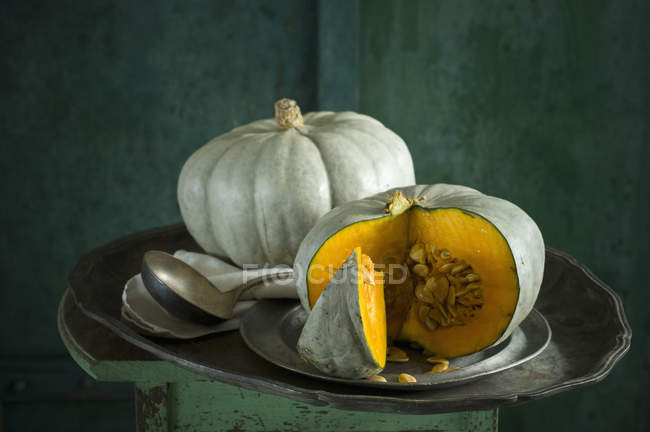 Fresh pumpkins on rustic wooden background — Stock Photo