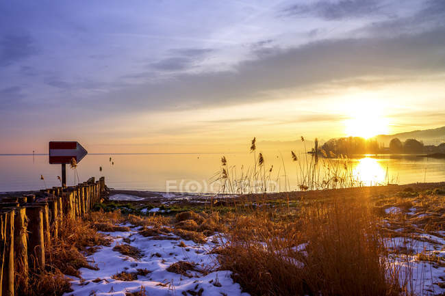 Switzerland, Thurgau, Lake Constance, Romanshorn in winter at sunset — Stock Photo