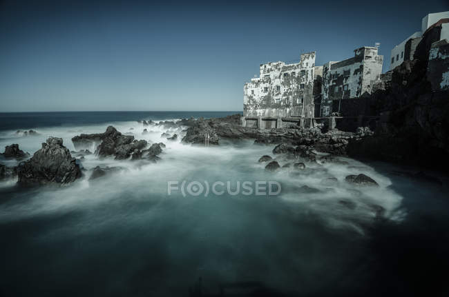 Spain, Canary Islands, Tenerife, Puerto de la Cruz, ramshackle building at the coast — Stock Photo