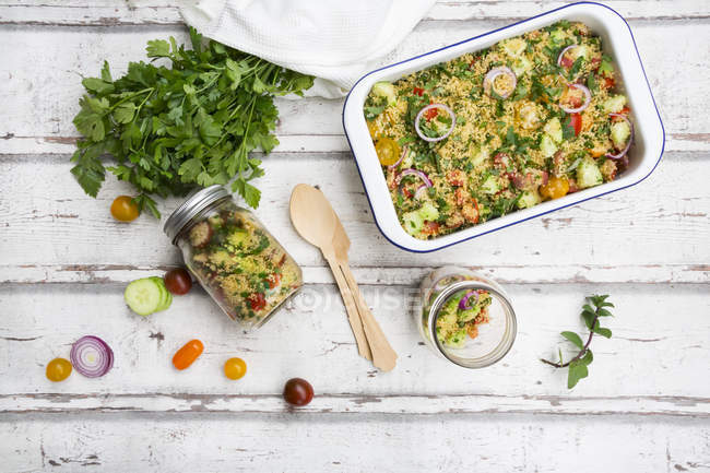 Couscous salad with tomatoes, cucumber, parsley and mint — Stock Photo