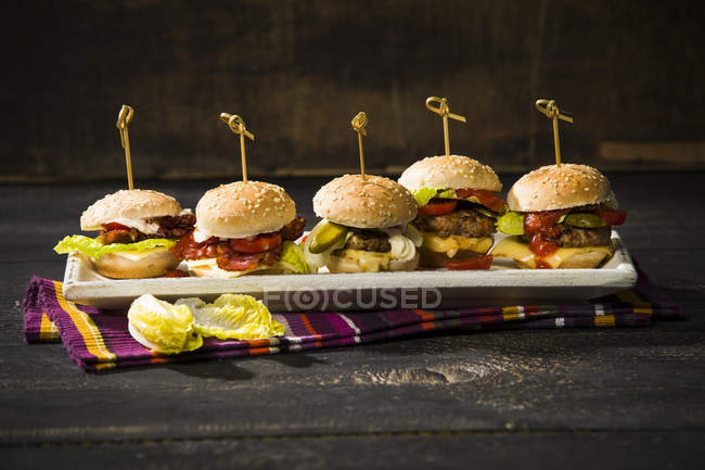 Close up of Mini burgers on plate — Stock Photo
