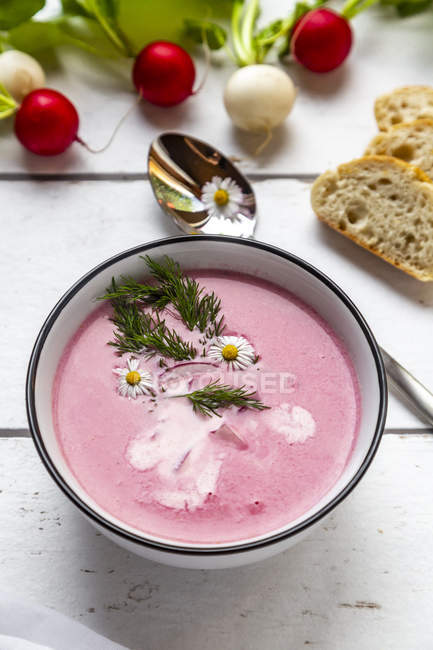 Radish soup with baguette — Stock Photo