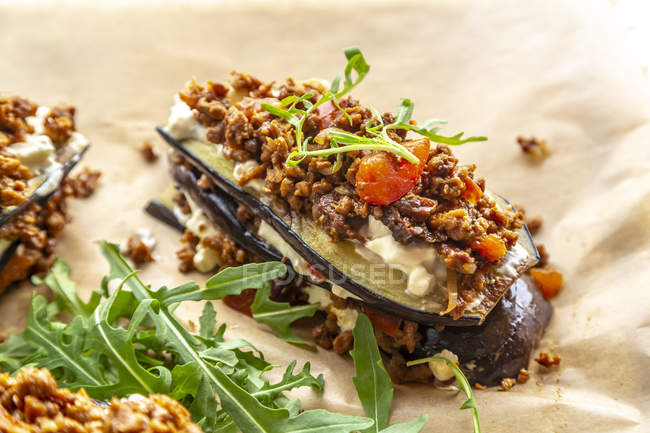Aubergine lasagne on baking paper, vegetarian — Stock Photo