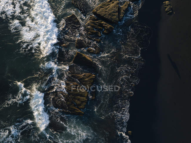 Indonesia, Bali, Indian Ocean, Aerial view of rocky coast and waves — Stock Photo