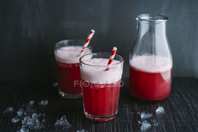 Drink: Switchel, drink with ginger, apple vinegar, coconut water, cranberry juice, lemon, cruched ice, honey — Stock Photo